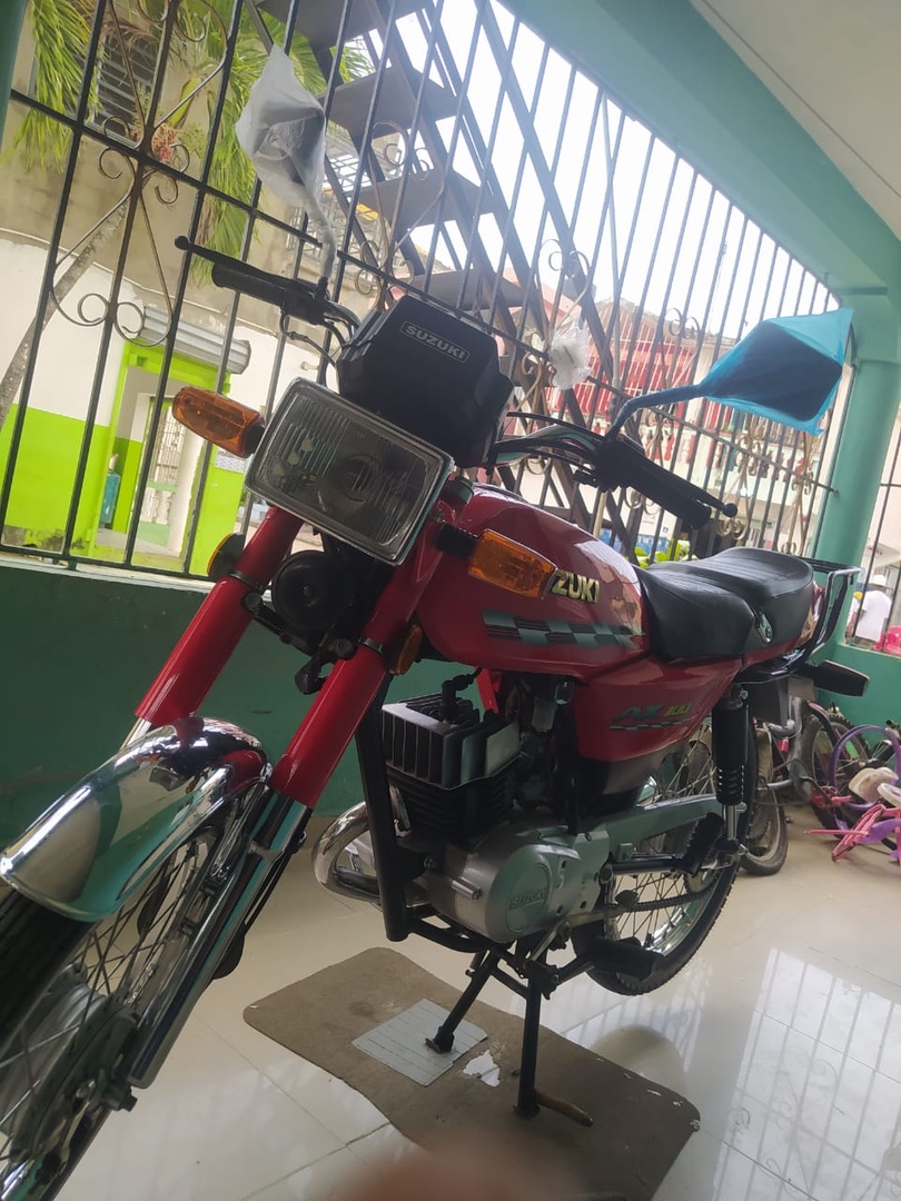 motores y pasolas - Suzuki  rojo 75,000